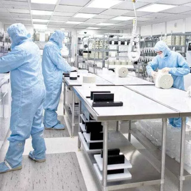 Peflon technical team providing on-site support in a cleanroom facility